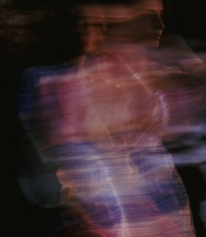 A person in motion, blurred to show movement and flow.